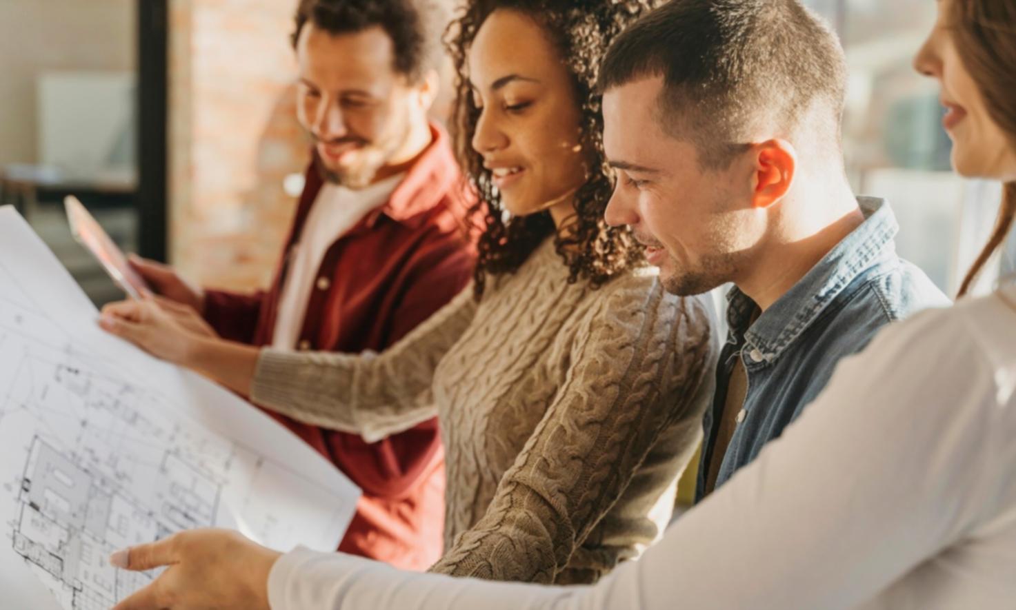 UAT coordinator facilitating discussion between developers and business stakeholders