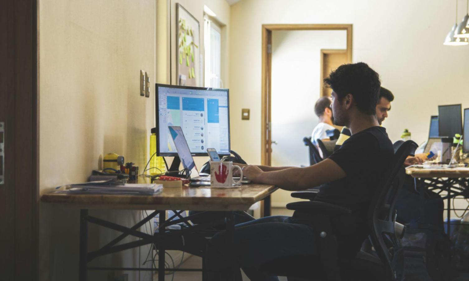 Testing team analyzing user feedback during acceptance testing session